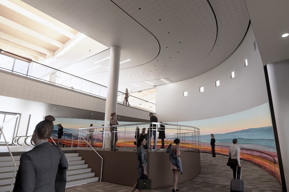 Rendering of an airport interior with travelers walking through a multi‑level concourse featuring curved architecture and a large landscape mural along the wall.